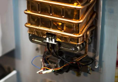 Electrical coil in the distribution panel with wires. Small electromagnet. El Stock Photos