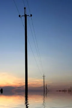 Electrical columns flooded on water Stock-Fotos