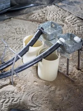 Electrical conduit and junction boxes under construction Stock Photos