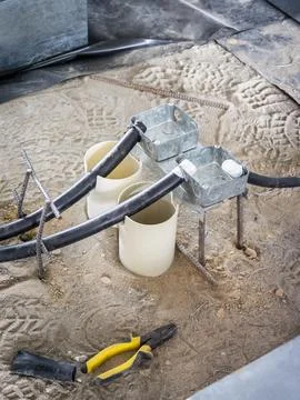Electrical conduit and junction boxes under construction Stock Photos