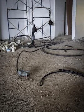 Electrical conduit installation inside unfinished building Stock Photos