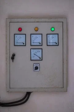Electrical control panel with three indicator lights button of different colors. Stock Photos