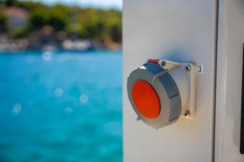 Electrical control switch mounted on a white panel of Electric charging station Stock Photos