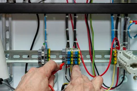 Electrical controls engineer testing a circuit Foto stock
