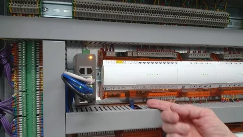 Electrical controls engineer testing wiring circuits Stock Footage 96463349