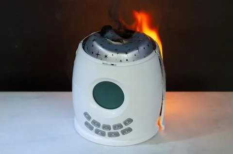 Electrical device failure causes night lamp ignition creating fire risk and s 스톡 사진