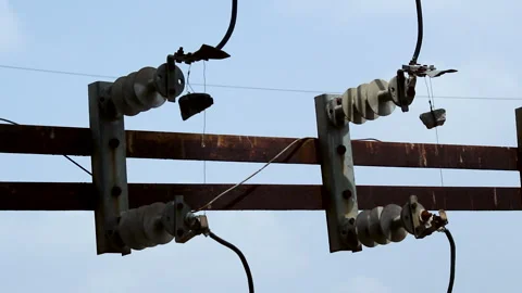 Electrical Disconnect Switch and Ceramic Insulators on Utility Power Line Stock Footage 337422449