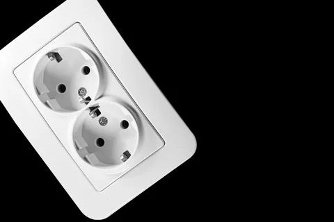 Electrical double socket for connecting devices on black Stock Photos