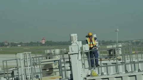 Electrical engineer airport service performs work on the telescope Stock Footage 115545829