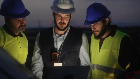 Electrical Engineer and technical industry workers discussing project of Stock Footage 219923041