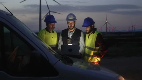 Electrical Engineer and technical specialists working on electricity wind power Stock Footage 220641747
