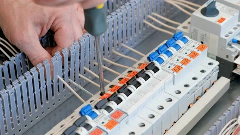 Electrical engineer assembles the mounting panel. Stock Footage 235971127