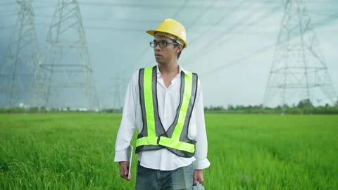 Electrical engineer carrying toolbox working outdoors Stock Footage 156711441