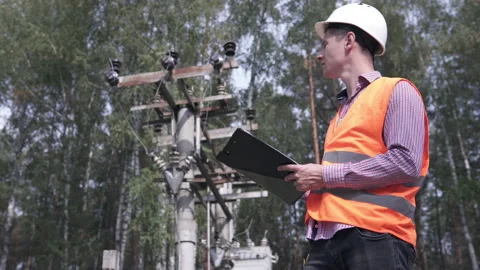 An electrical engineer checks the power line. Stock Footage 146511309