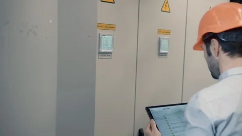 Electrical Engineer In helmet Fix Problem. Electrician Work In Server Room. Stockbeeldmateriaal 104198844