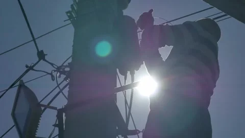 Electrical engineer with high voltage electricity pylon on the background of the Stock Footage 148048178