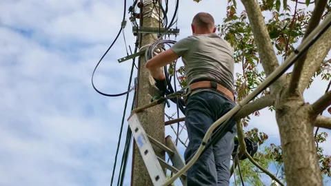 Electrical engineer with high voltage electricity pylon on the background of the Stock Footage 156793872