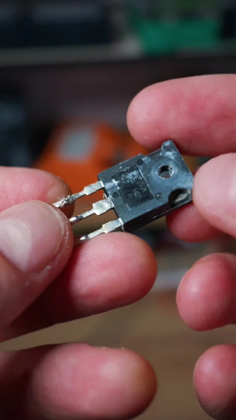 Electrical Engineer Holding Small Electronic Transistor Component Close Up Stock Footage 339364685