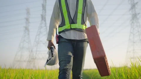 Electrical engineer holding a toolbox Walk to an electrical repair job Stock Footage 148344320