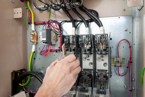 Electrical engineer inserting a fuse Stock Photos
