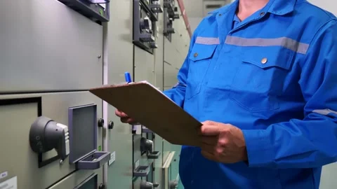 Electrical Engineer Inspecting Control Panel in Industrial Substation 库存影片 290927675
