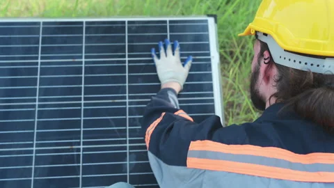 An electrical engineer is inspecting a solar cell t Stock Footage 255224129