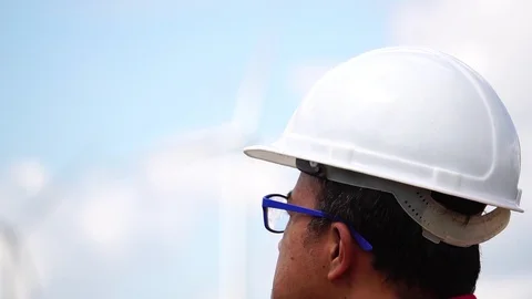 Electrical engineer man are standing monitoring of wind turbine Stock Footage 105726646