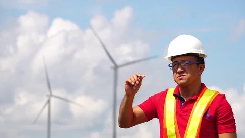 Electrical engineer man are standing monitoring of wind turbine Stock Footage 105726864