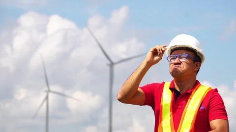 Electrical engineer man are standing monitoring of wind turbine Видео 105726892