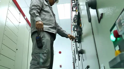 Electrical Engineer Measuring Power at Electrical Load Panel and Applying Lockou Stock-Footage 343904508