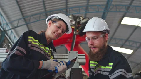 Electrical engineer with the mission of installing a robot arm electrical system Stock Footage 254545001