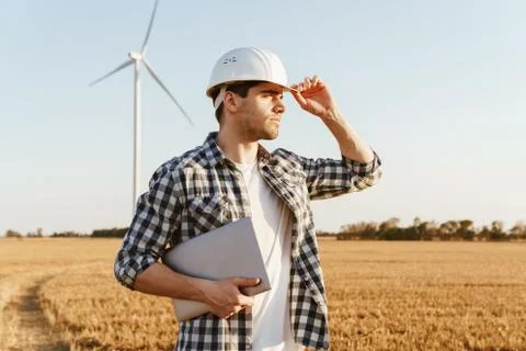 An electrical engineer standing on a field Stock Photos