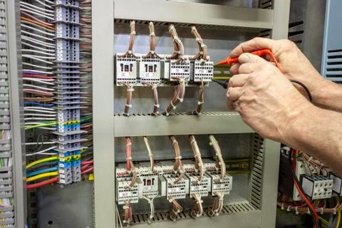 Electrical engineer testing a contactor Stock Photos