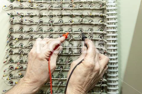 Electrical engineer testing a fire indicator panel 写真素材