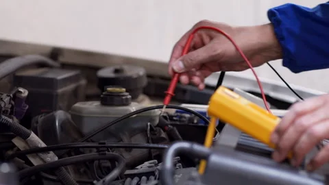 Electrical engineer uses multimeter to test electrical installation and motor Stock-Footage 297775796