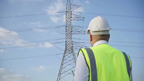 Electrical engineer working and look forward. He walking on the High voltage  Stock Footage 149804918