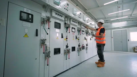 Electrical engineer working check the electric current voltage and overload Stock Footage 209122549