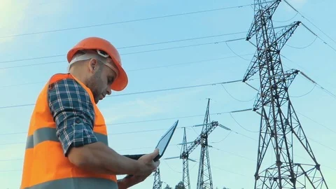 Electrical engineer working. Talking on the phone and working working on a la Stock Footage 78627009