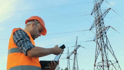 Electrical engineer working. Talking on the phone and working working on a la Stock Footage 78627058