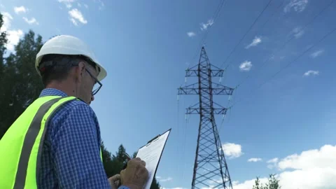 Electrical engineer works by inspecting power lines Stock Footage 157821449