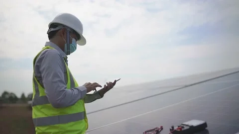 Electrical Engineering Examines Solar Panels in Renewable Energy Generation Stock Footage 173365518