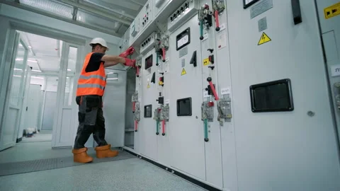 Electrical engineers inspect the electri... | Stock Video | Pond5