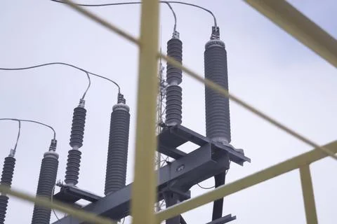 Electrical high-voltage insulators made of reramics on electrical substations Stock Photos