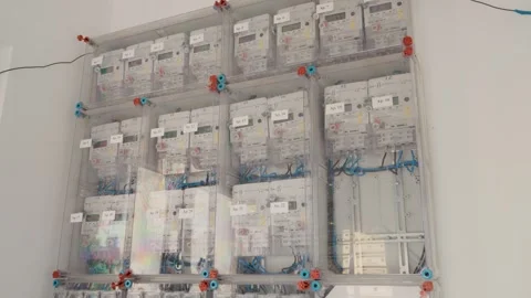 Electrical installations with meters and cables in a utility block setting Vídeos de archivo 347203917