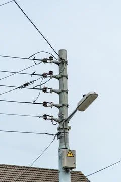 Electrical installations, pole with voltage cables Stock Photos