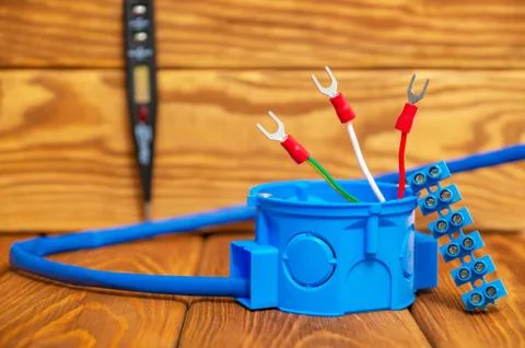 Electrical junction blue box with cable wire used in the electric installatio Stock Photos