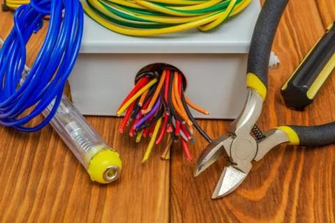 Electrical junction box with cables wire and tools used in the electric insta Stock Photos