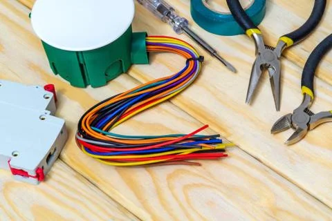 Electrical junction box with wires and tool usually used in the electric inst Stock Photos