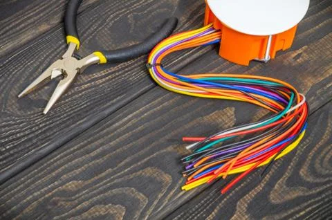 Electrical junction box with wires and tool usually used in the electric inst Stock Photos