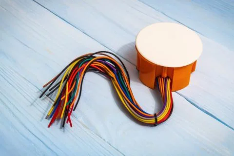 The electrical junction box with wires on blue boards usually used in the ele Stock Photos